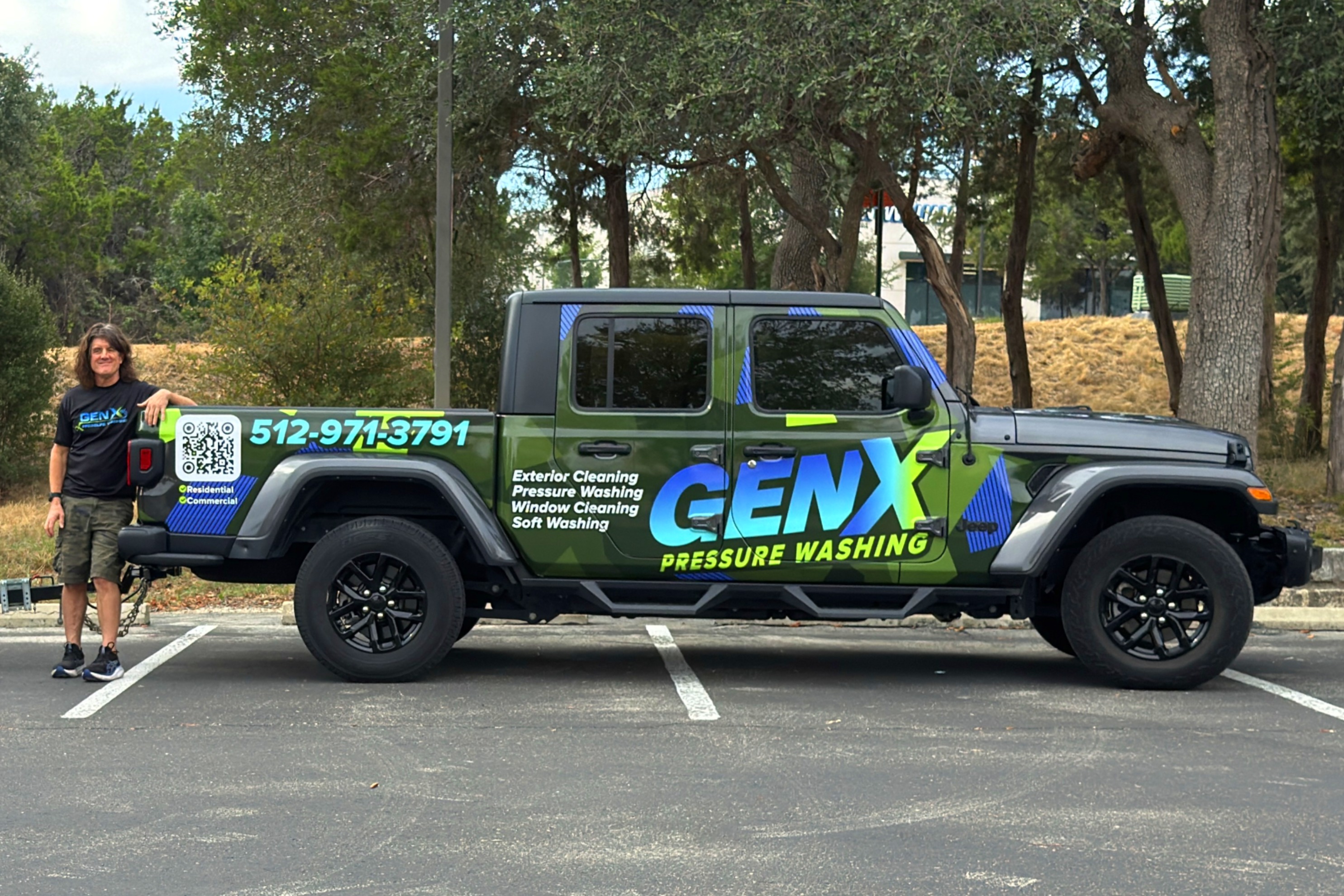 Duane Miller with his arms resting on the GenX Pressure Washing Trailer